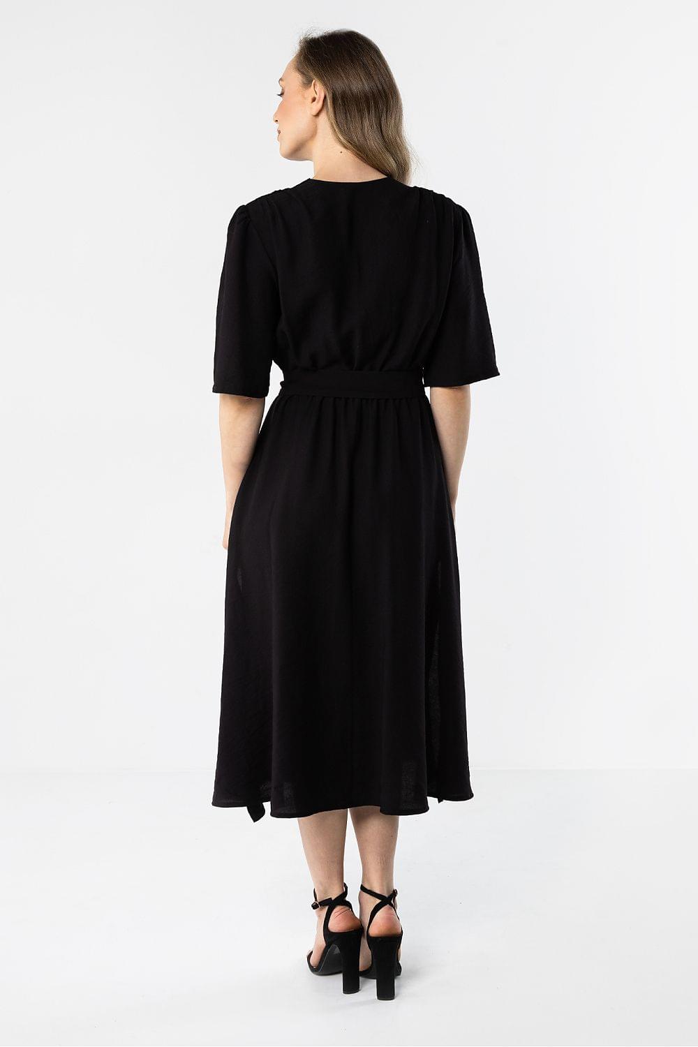 Black day dress with short sleeves, gathered waist, and back neckline