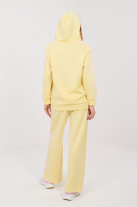 Yellow back view hooded zip jacket and wide-leg pants