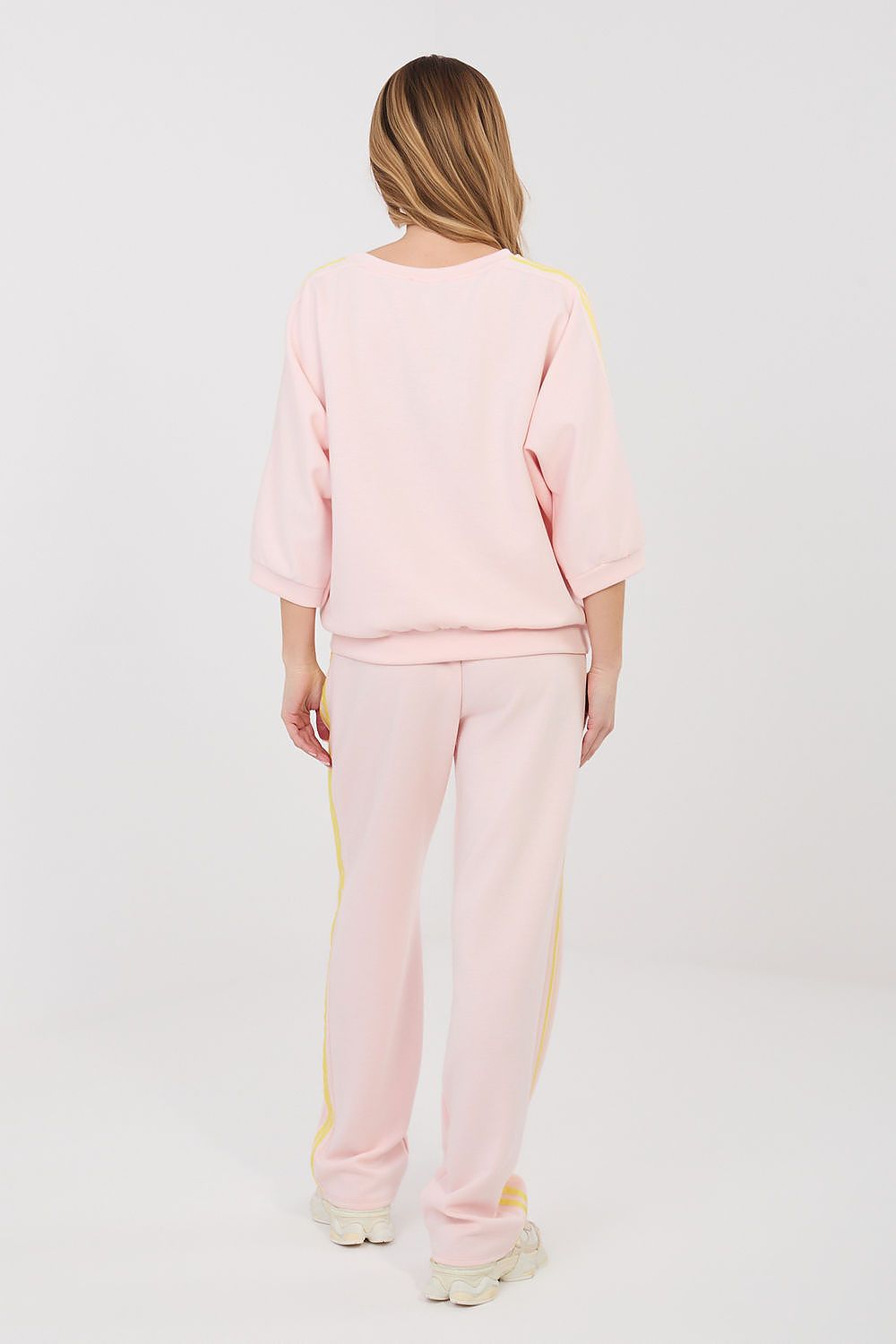 Pink two-piece tracksuit set with yellow side stripes, crew sweatshirt and jogger pants