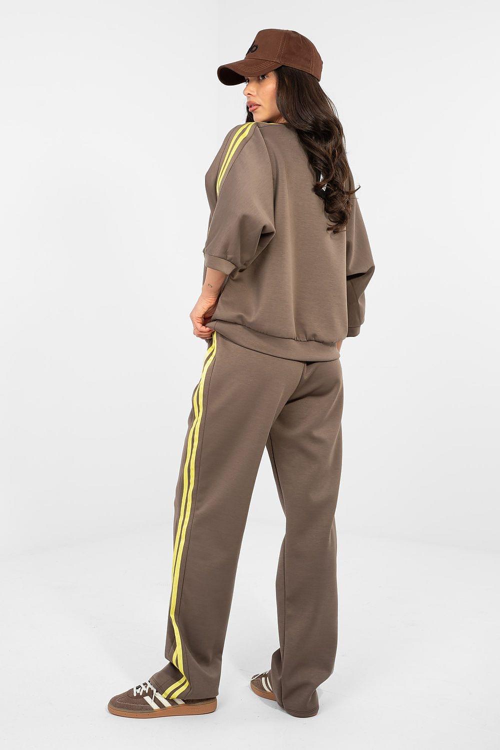 Brown tracksuit set with yellow piping joggers and short-sleeve sweatshirt, side view