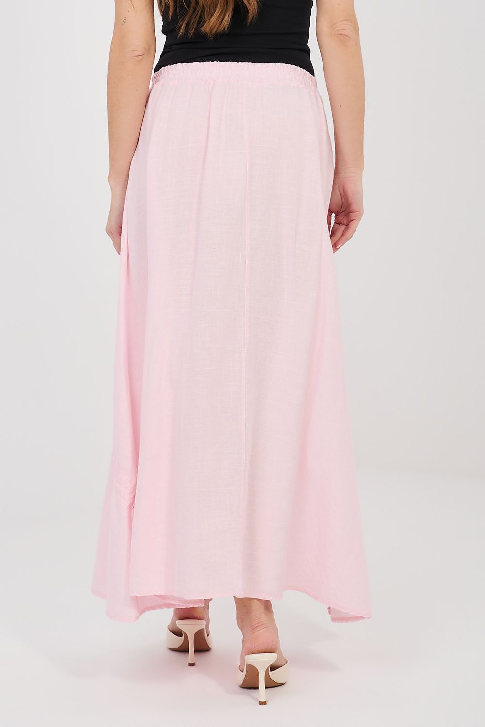 Pink long skirt with elastic waistband and loose gathered drape, rear view