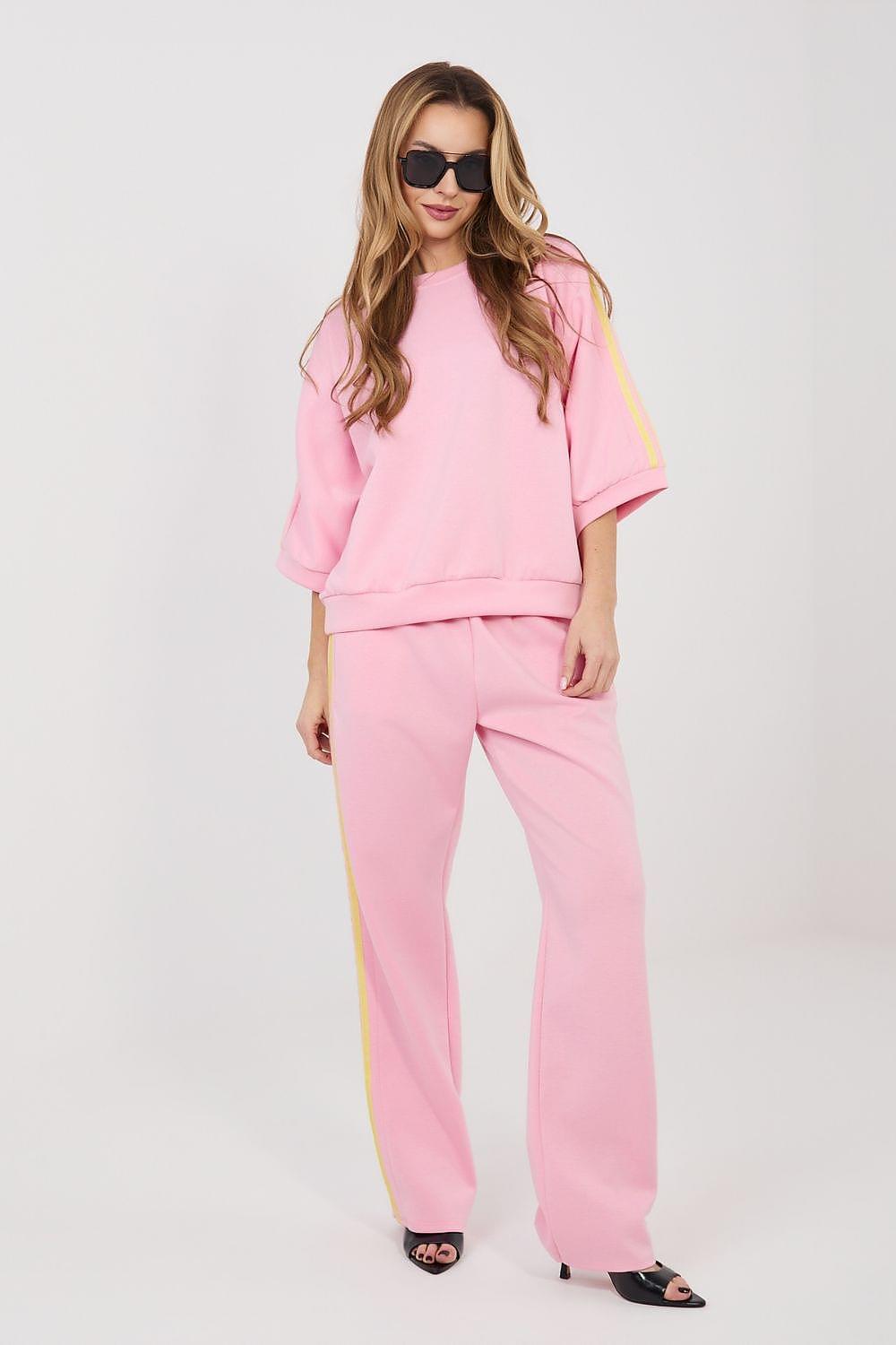 Pink two-piece lounge set with sweatshirt and wide-leg pants, yellow side stripe