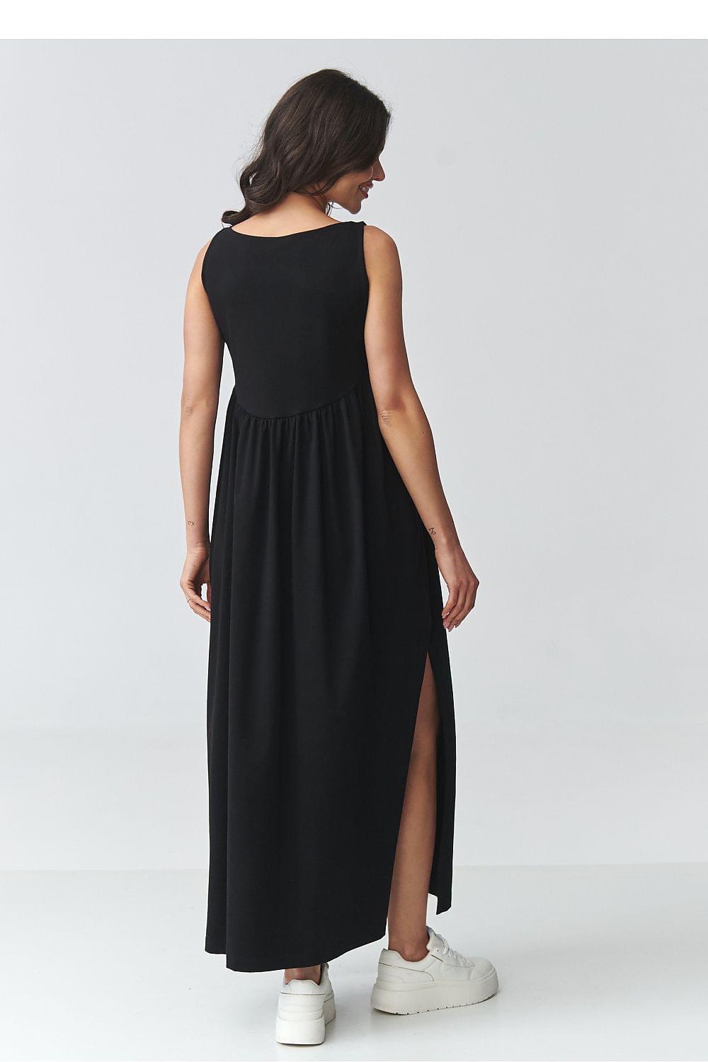 Black sleeveless daydress with gathered waist and long skirt with side slit