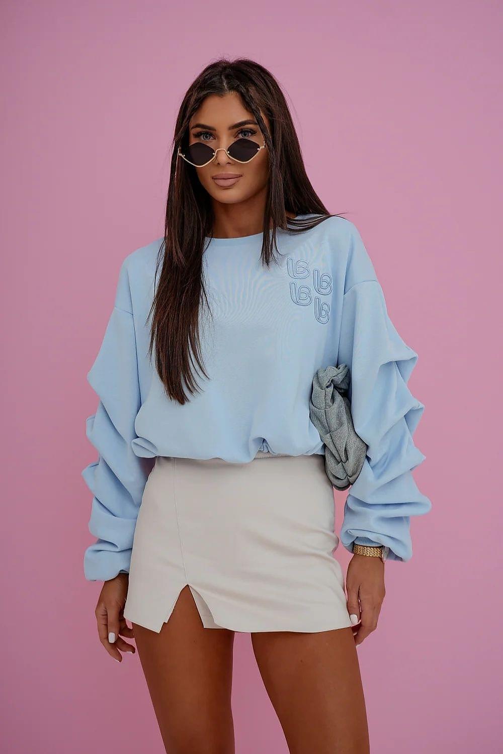 Light blue skort with front slit and mini skirt overlay, tailored waist
