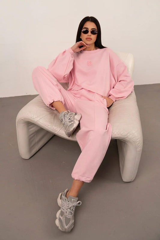 Pink two-piece set: long-sleeve sweatshirt and ankle jogger pants with elastic cuffs