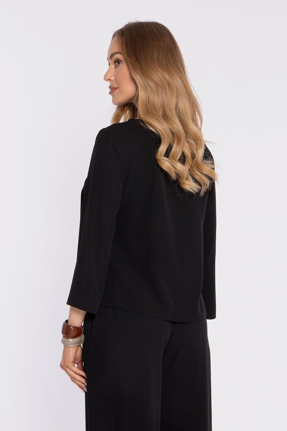 Black blouse with 3/4 sleeves and round neckline, side view