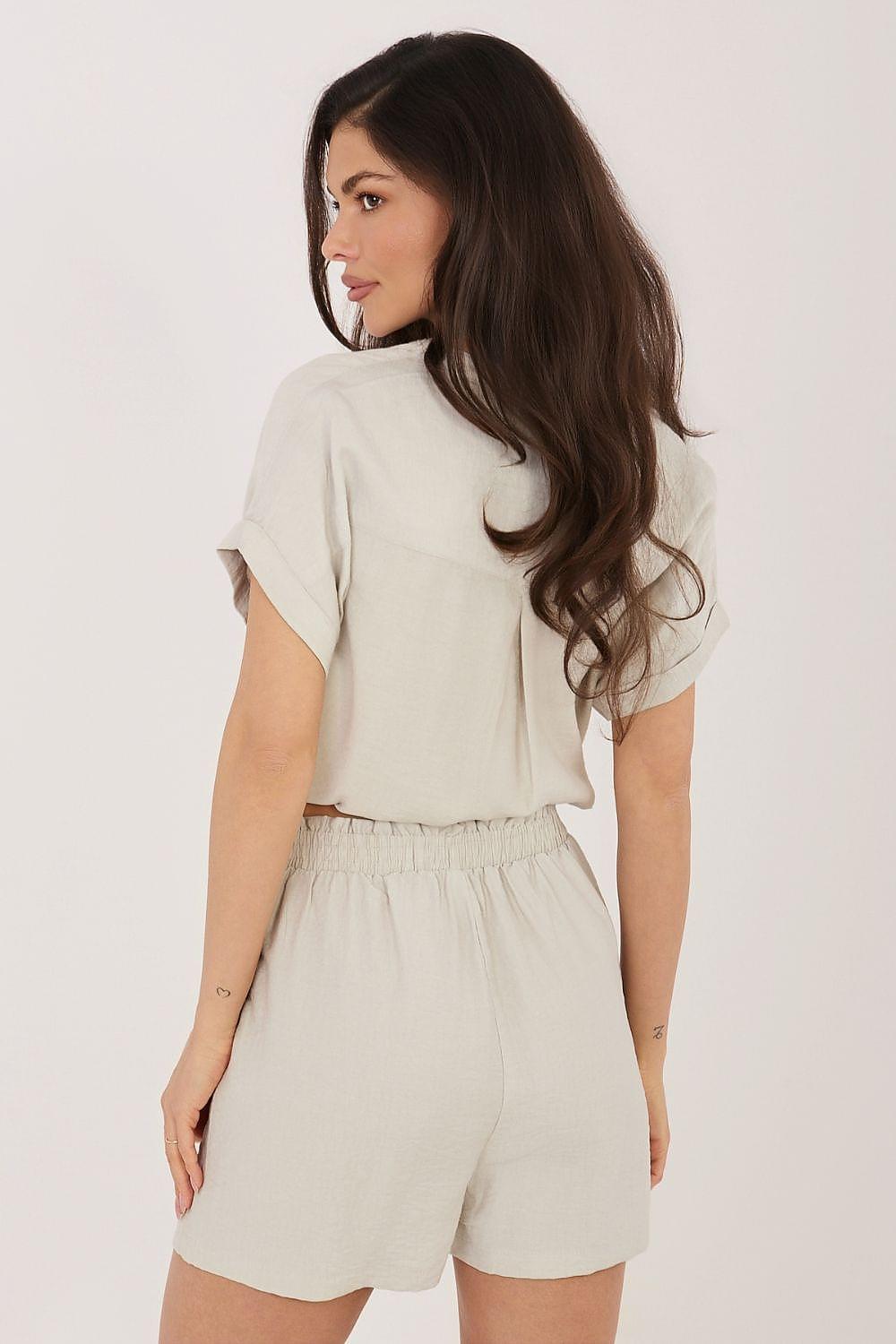White shorts with elastic waist and loose, slightly gathered leg
