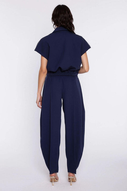 Nife women's navy blue trousers, back view with elastic waist and tapered cuffs