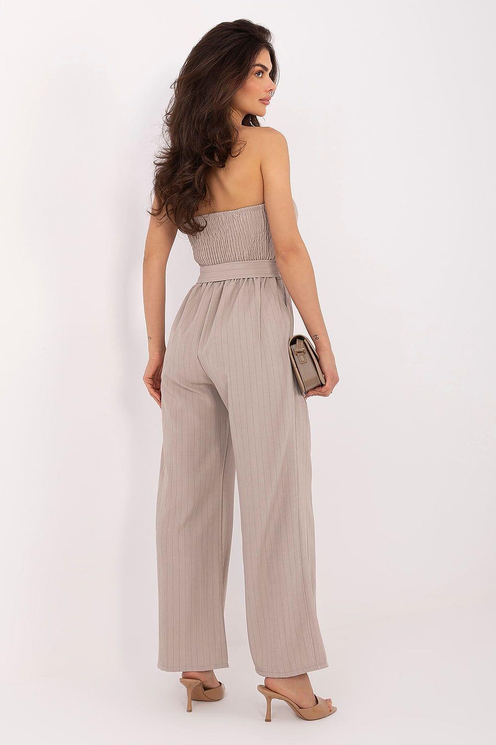 Women’s beige strapless wide-leg jumpsuit with vertical texture and waist tie at waist