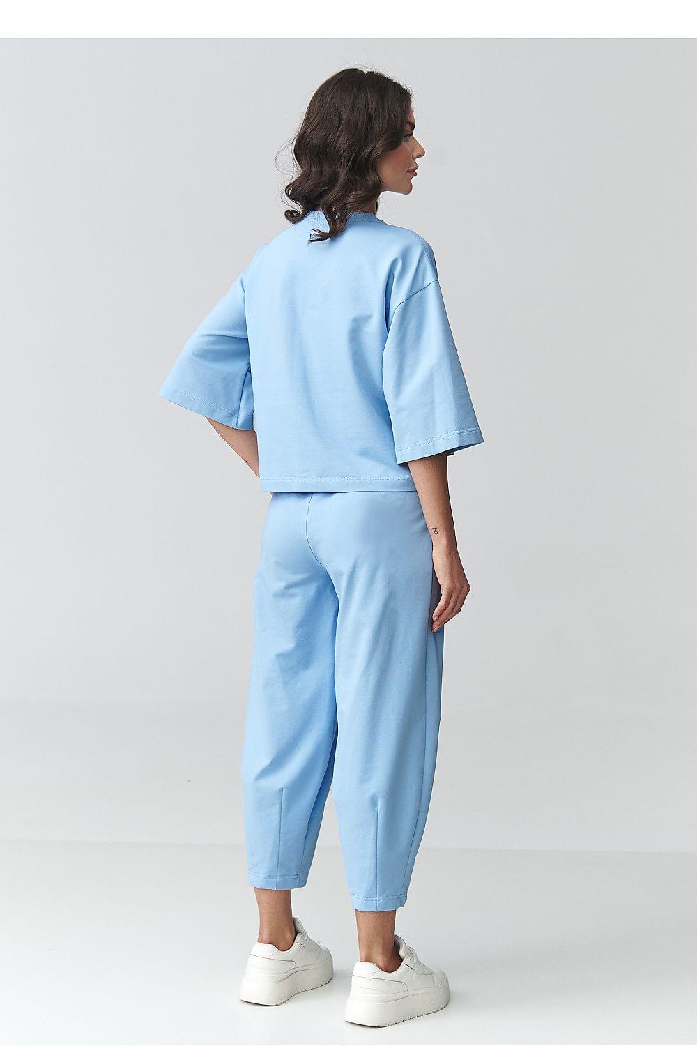 Two-piece set with short-sleeve top and cuffed tapered pants, light blue, back view