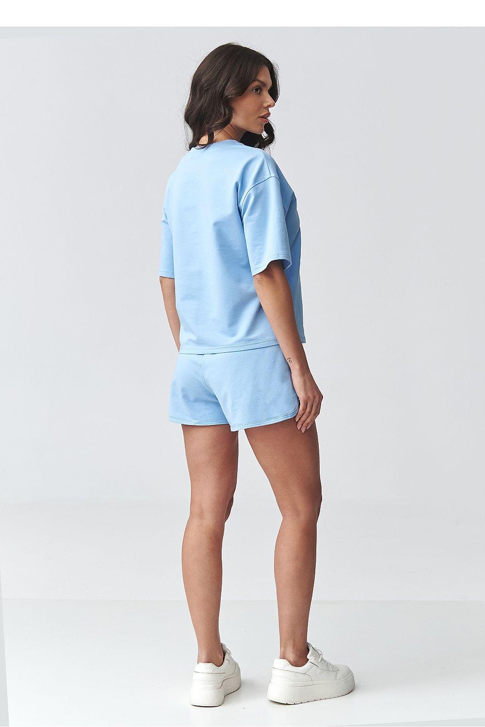 Light blue two-piece set from the back: short-sleeve top and matching elastic-waist shorts