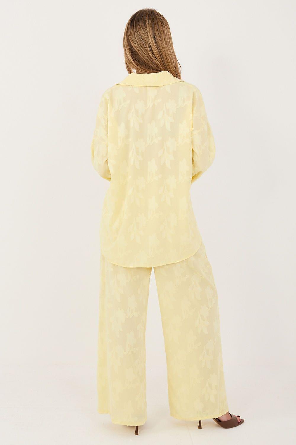 Yellow two-piece set with long-sleeve blouse and wide-leg trousers, back view