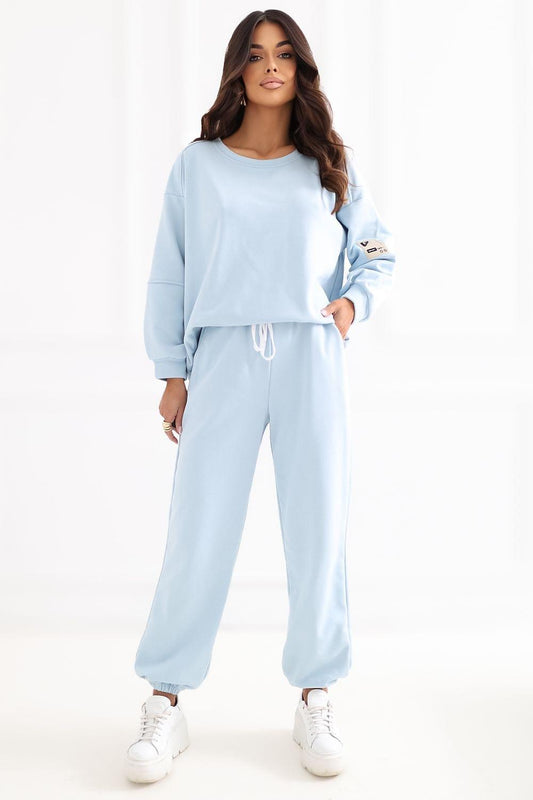 Light blue tracksuit set with crew sweatshirt and wide jogger pants with drawstring waist