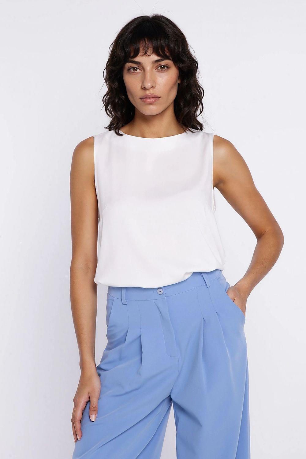 White sleeveless blouse with loose drape and round neckline