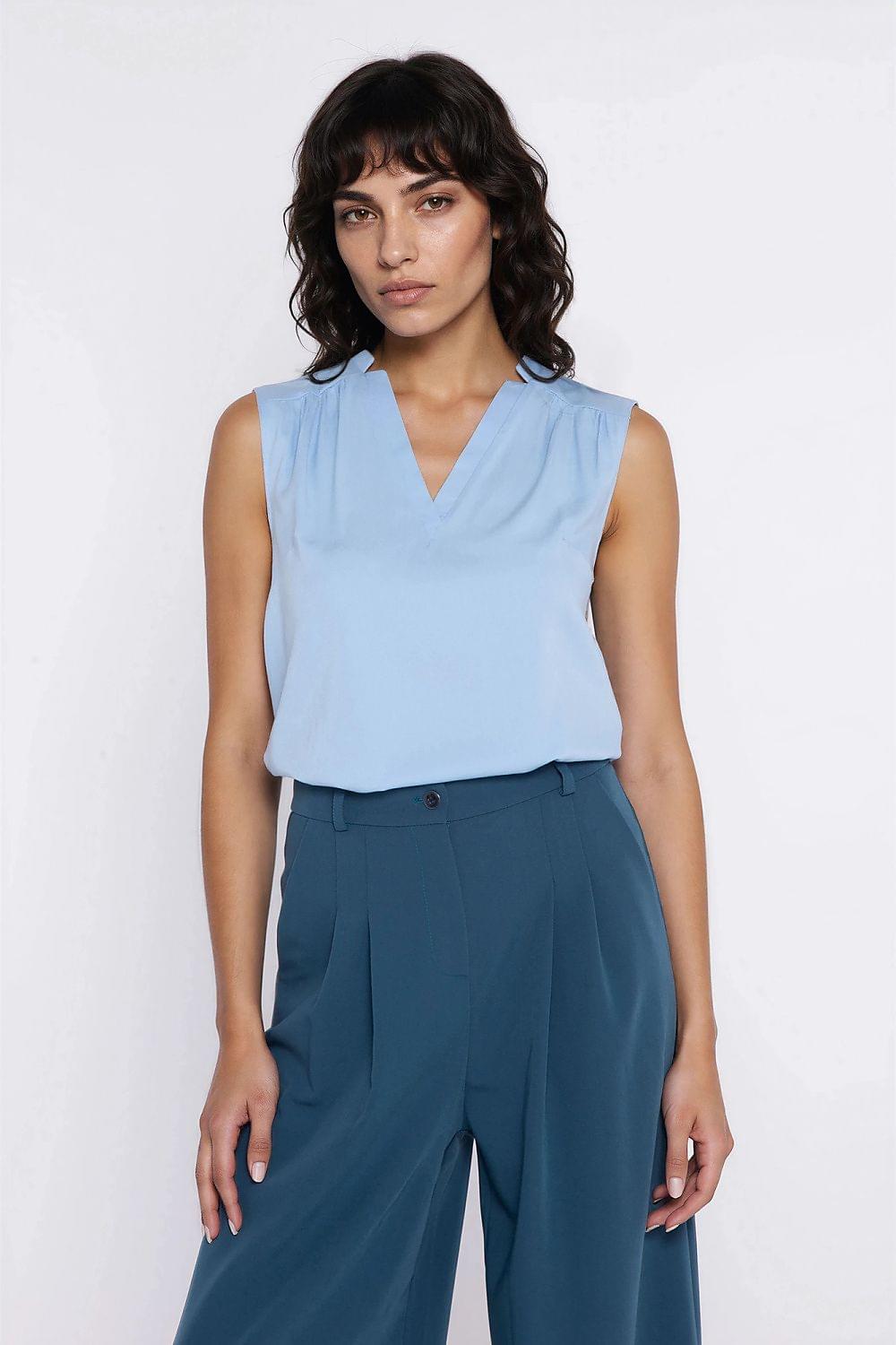 Light blue sleeveless V-neck blouse with clean neckline and draped fit