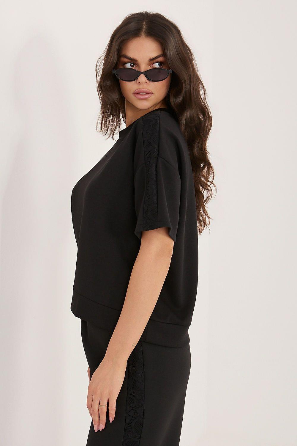 Black short-sleeve blouse, side view with wide neckline and cuffed sleeve