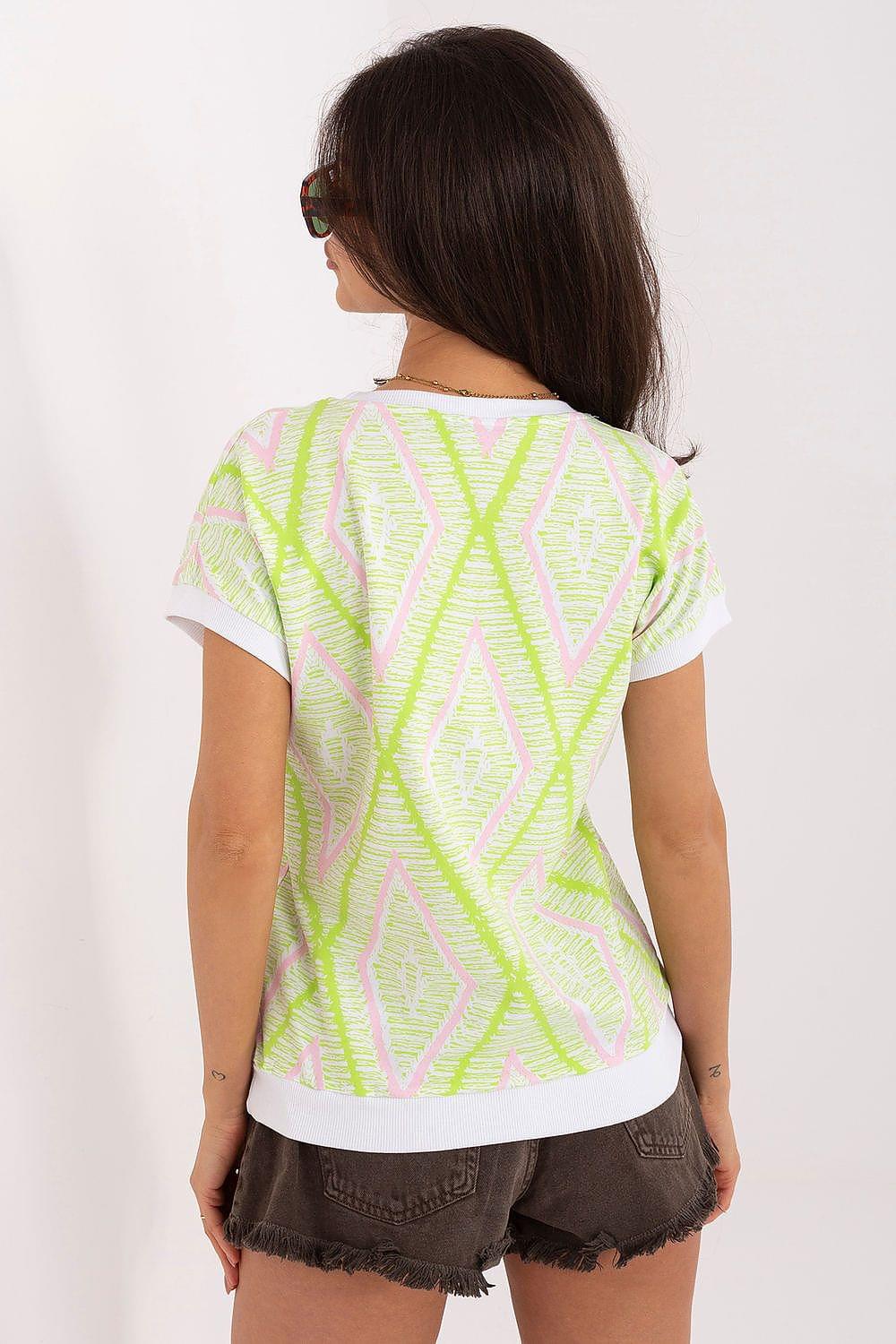 Neon yellow-green geometric patterned blouse, back view, short sleeves, crew neck