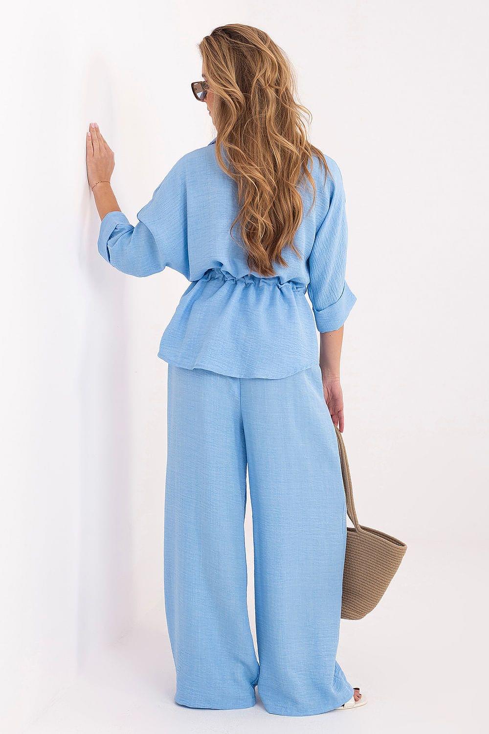 Light blue two-piece pants set with belted peplum blouse and wide-leg trousers