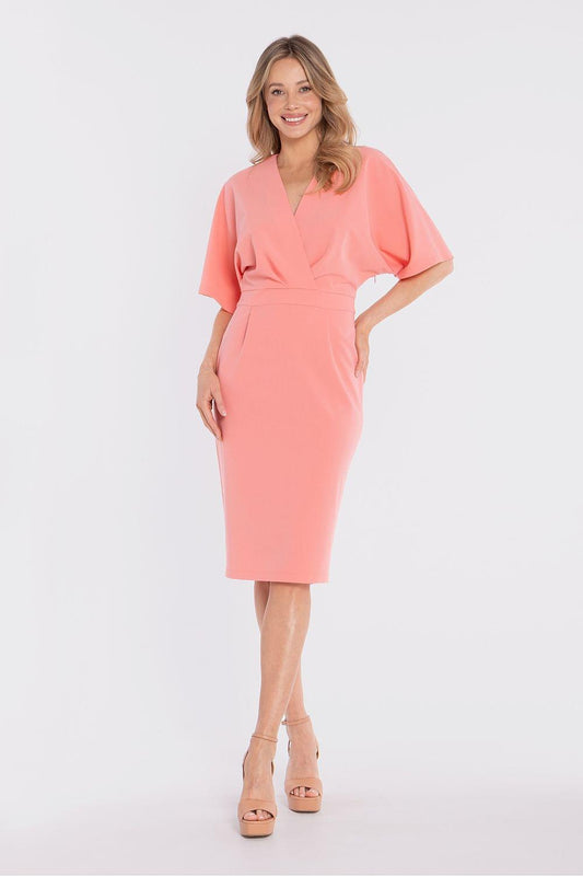 Coral pink day dress with V-neck wrap front, short sleeves, and knee-length straight skirt.