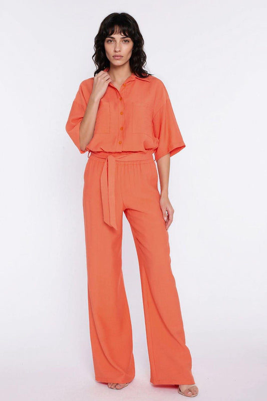 Orange wide-leg pants with tied elastic waist and relaxed straight legs