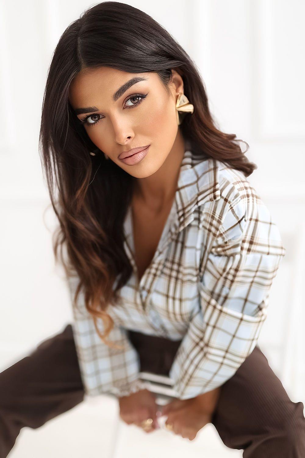 Beige plaid button-up shirt collar and long sleeves, close-up of button placket