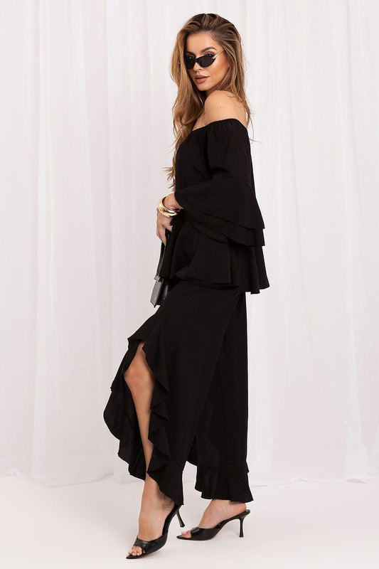Black off-shoulder tiered blouse and cropped wide-leg pants set, layered ruffles