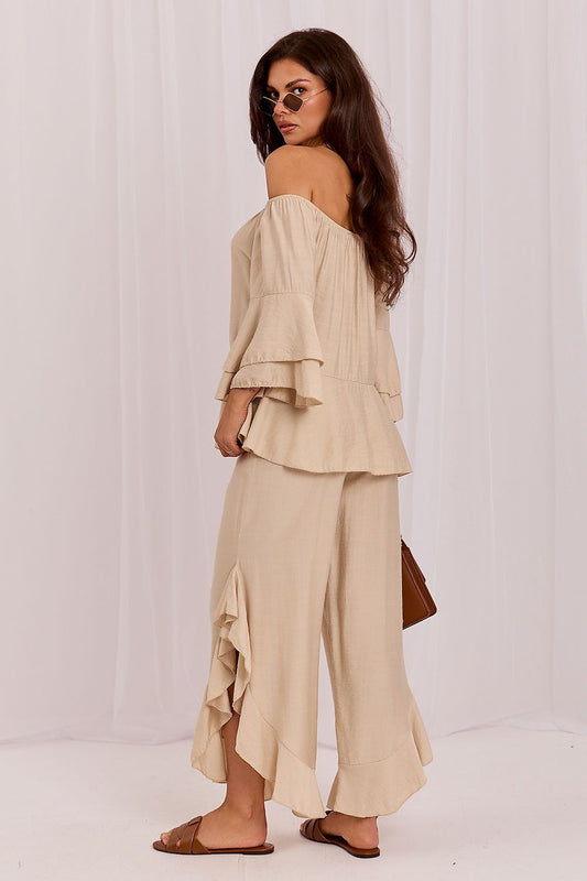 Beige two-piece set: off-shoulder ruffled top and asymmetric wide-leg pants