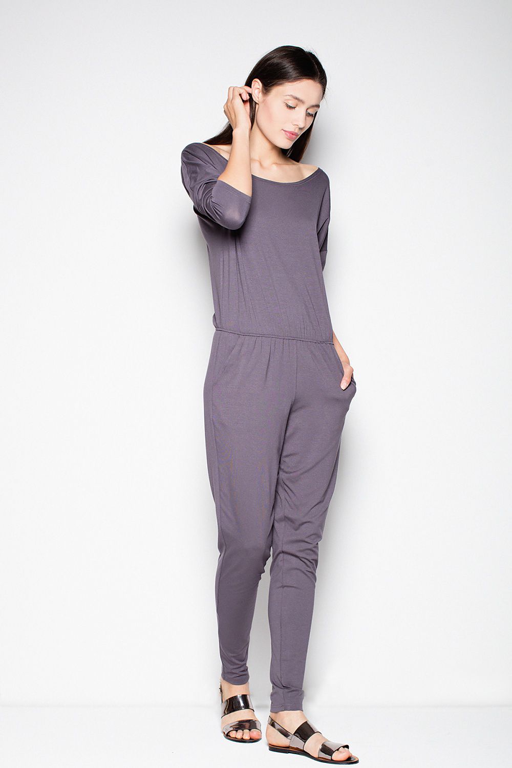 Grey long-sleeve sporty jumpsuit with scoop neck and gathered waist, ankle-length legs