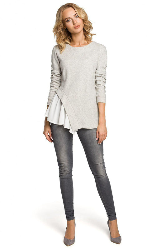 Grey long-sleeve blouse with crew neck and layered white curved hem detail