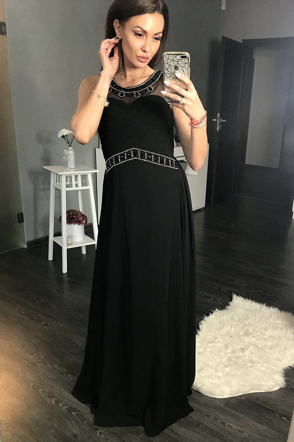 Embellished black maxi dress with beaded neckline and fitted waist