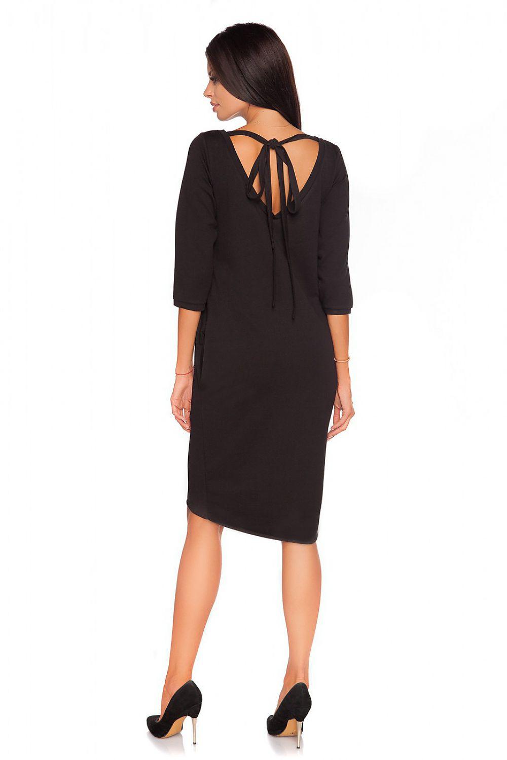 Black daydress back with tied keyhole neckline and knee-length straight hem.