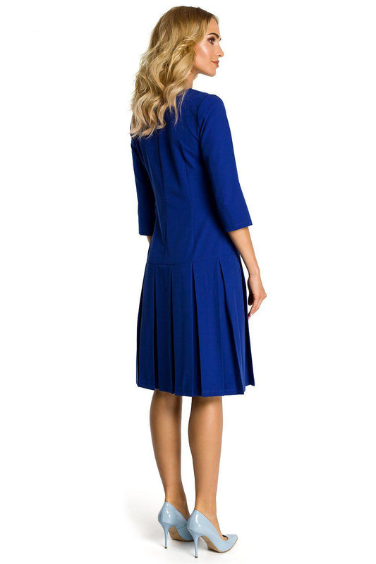 Blue daydress from side view with 3/4 sleeves and pleated skirt