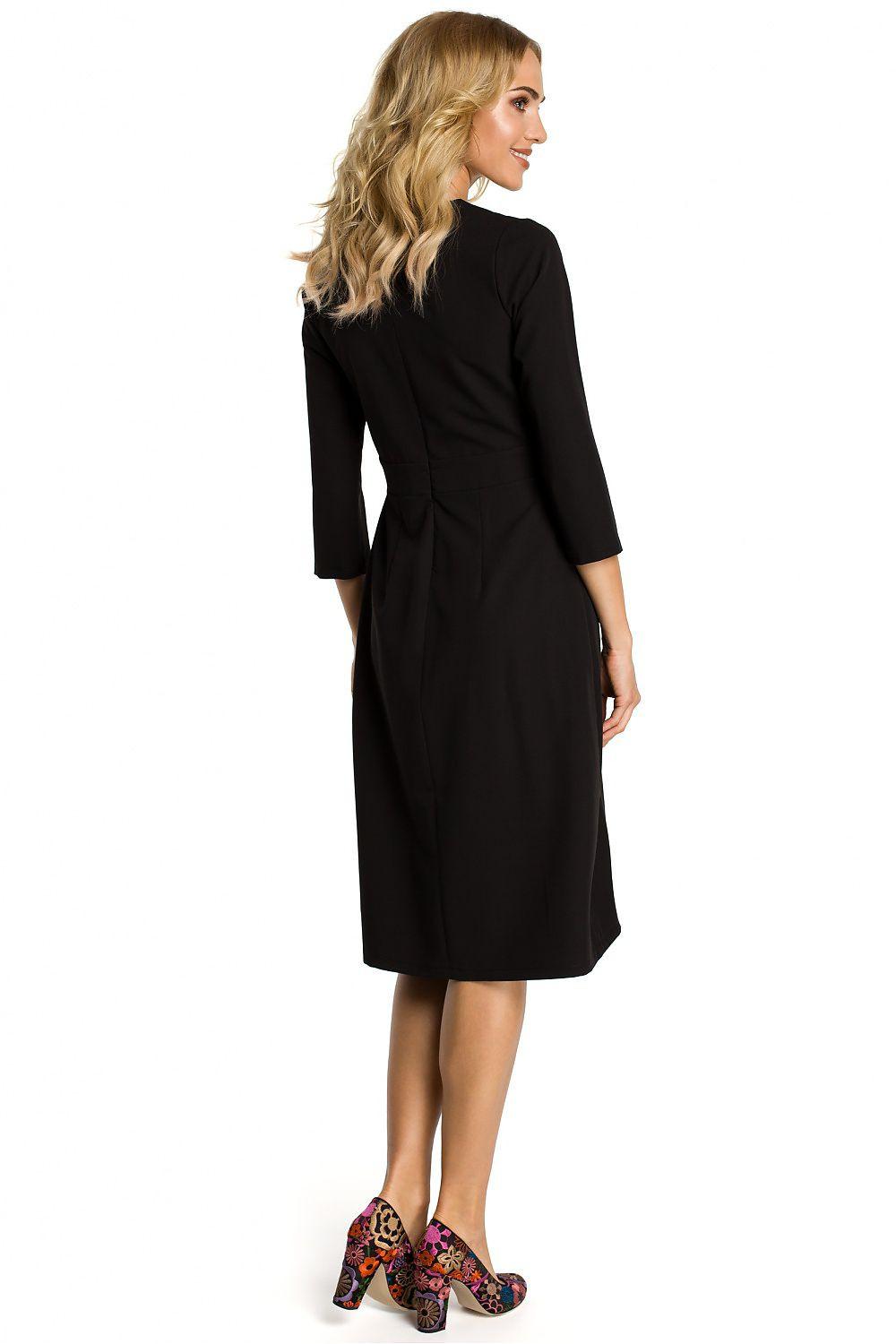 Black day dress with 3/4 sleeves and pleated skirt, back view, knee-length