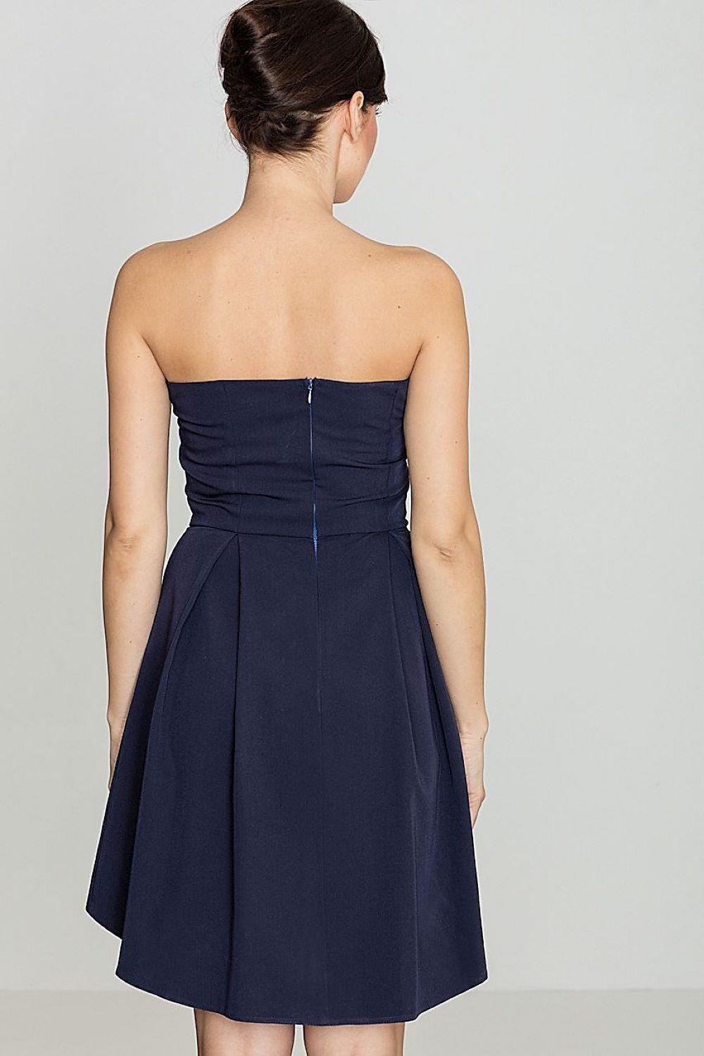 Navy strapless cocktail dress, back view, with pleated flared skirt and center seam