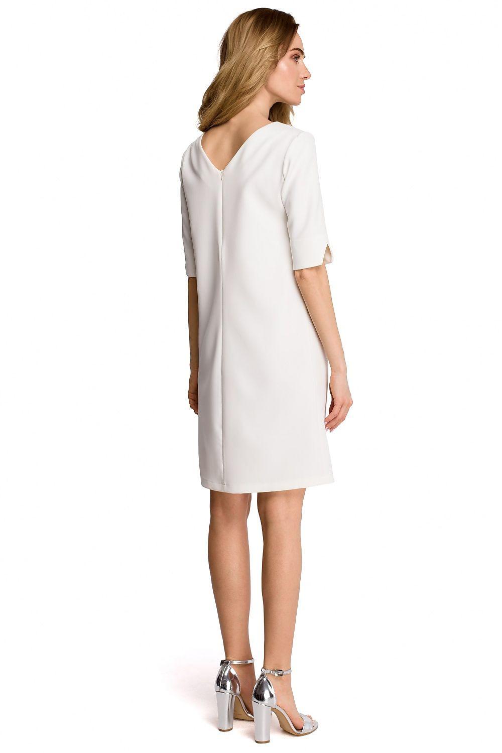 White daydress with short sleeves and back V-neck, straight knee-length cut.
