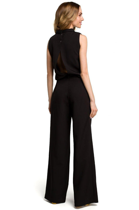 Black sleeveless top and high-waist wide-leg trousers, back view with open back.