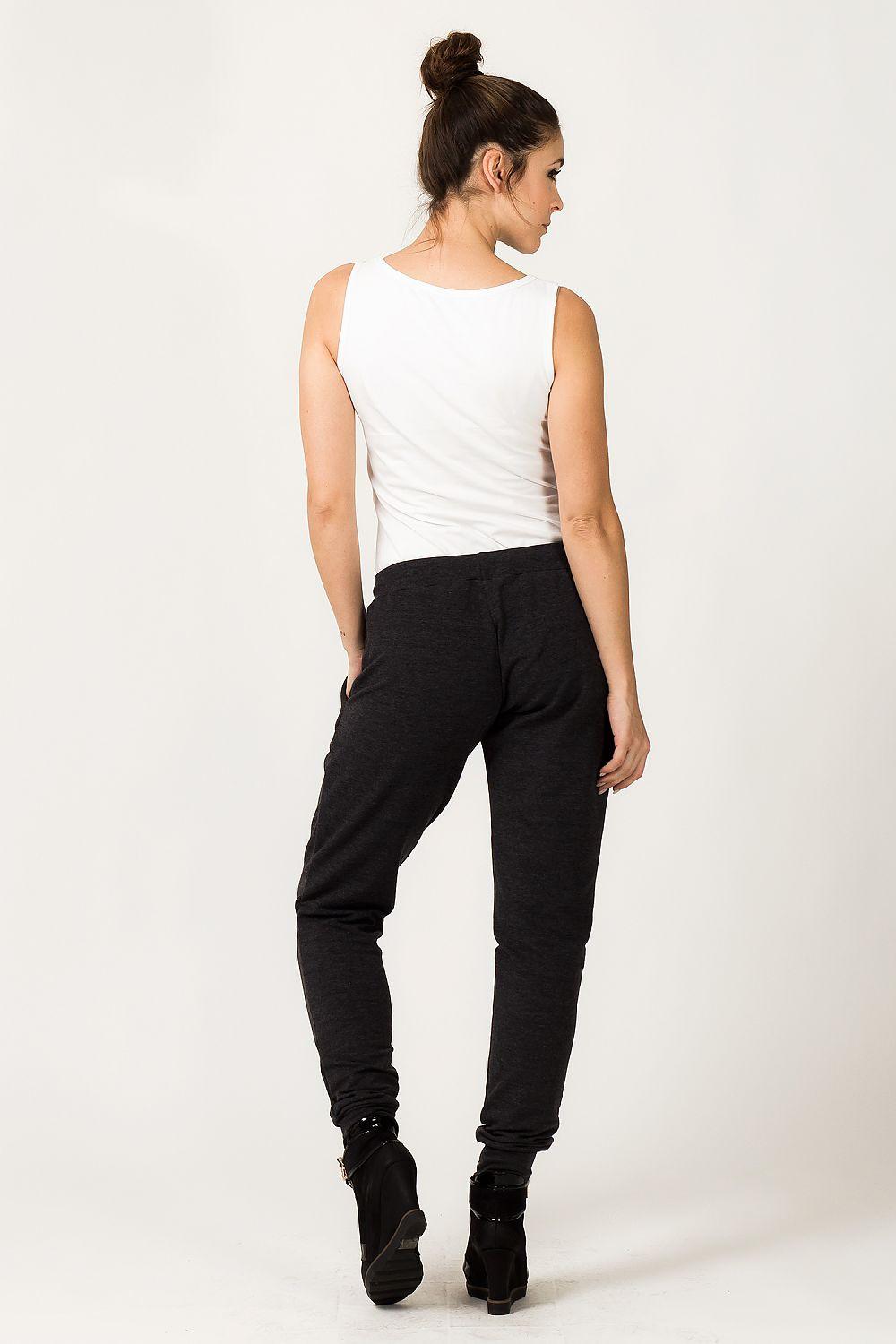 Tessita tracksuit trousers in black, tapered jogger fit, side view.