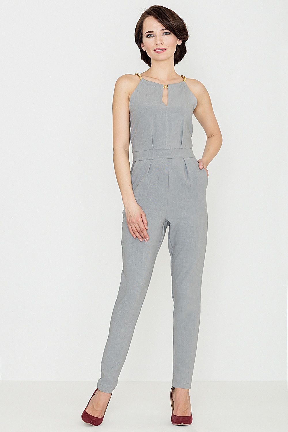 Grey sleeveless jumpsuit with chain accent and tapered legs