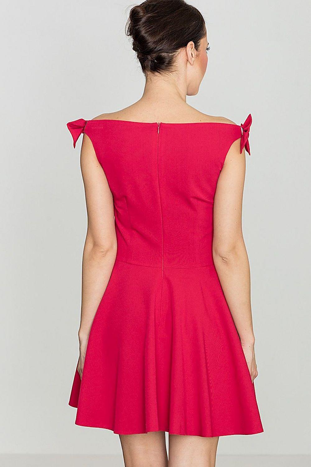 Red cocktail dress, back view, tied shoulder bows and flared skirt hem.