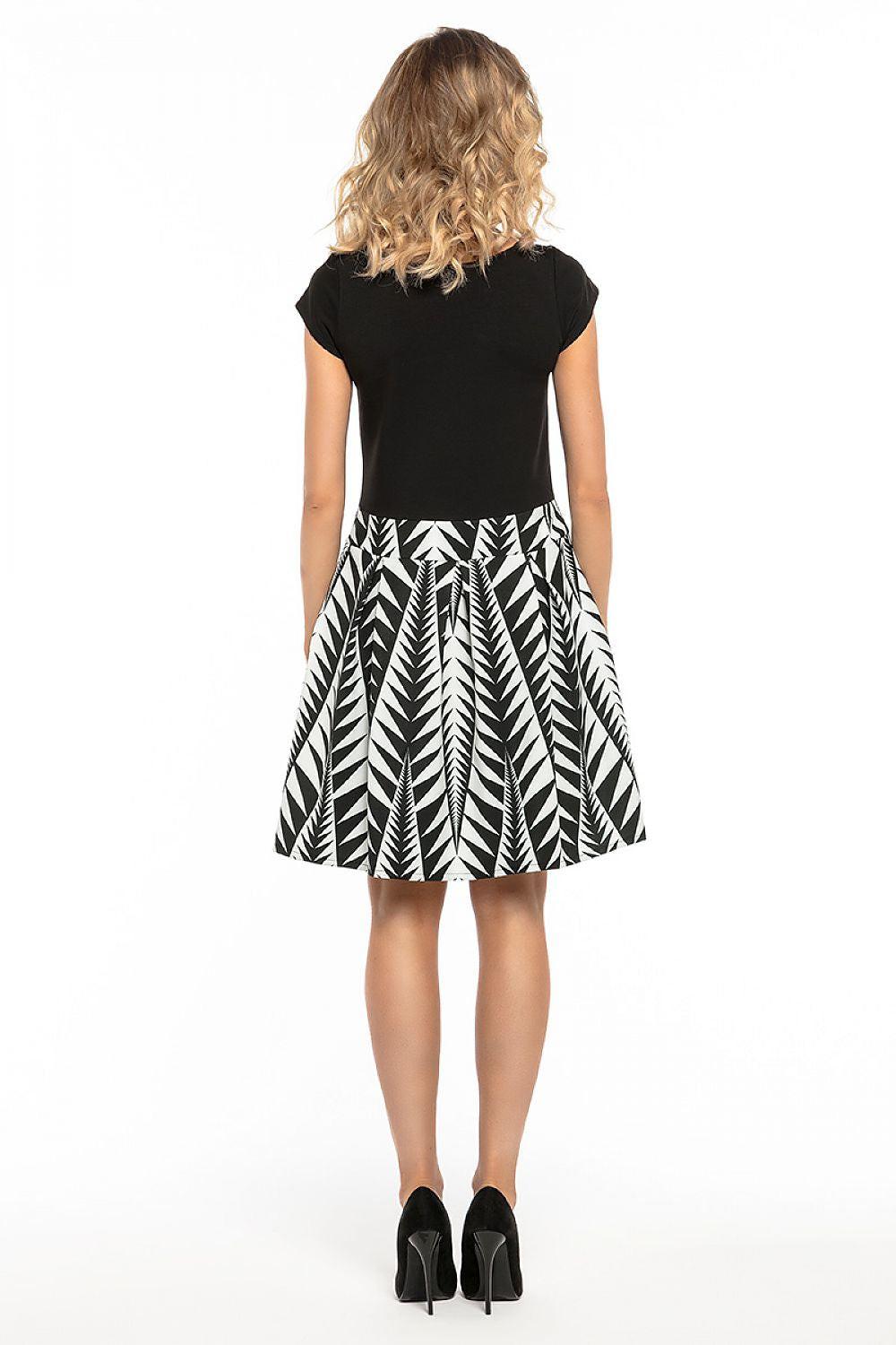 Tessita daydress back view, black top and white leaf-pattern skirt, cap sleeves