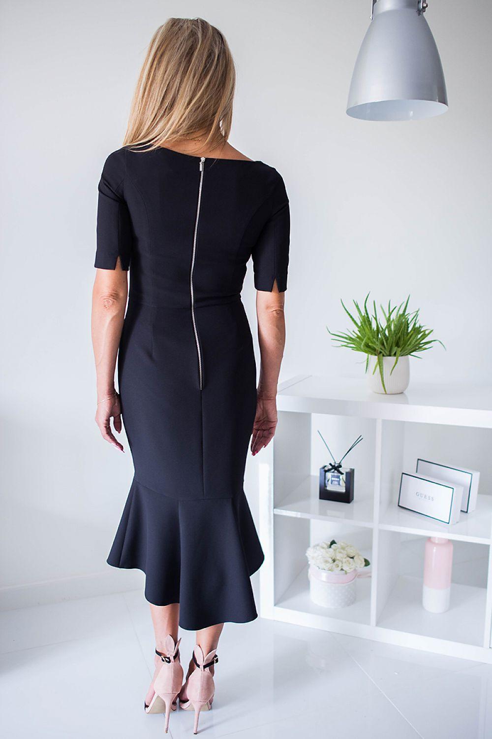 Black cocktail dress back view with center seam, flared midi hem and 3/4 sleeves