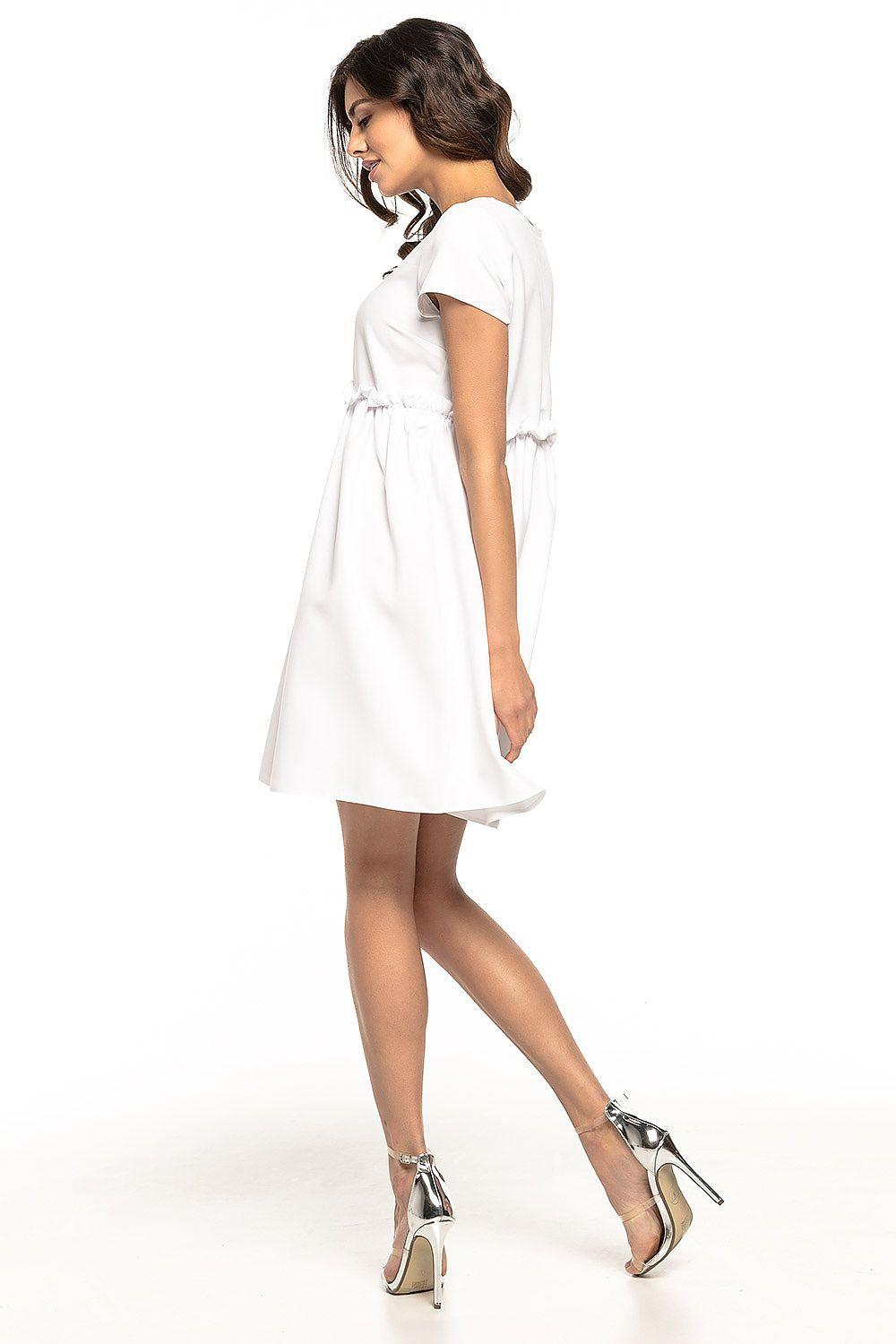 White daydress with short sleeves and gathered waist visible from the side