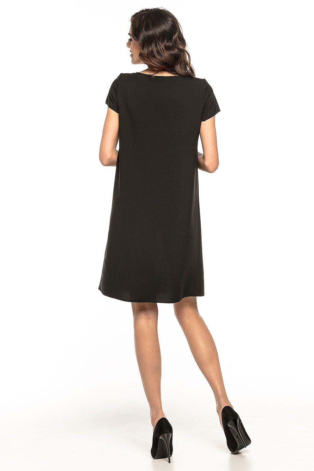 Black day dress back view with short sleeves, round neck, and A-line hem