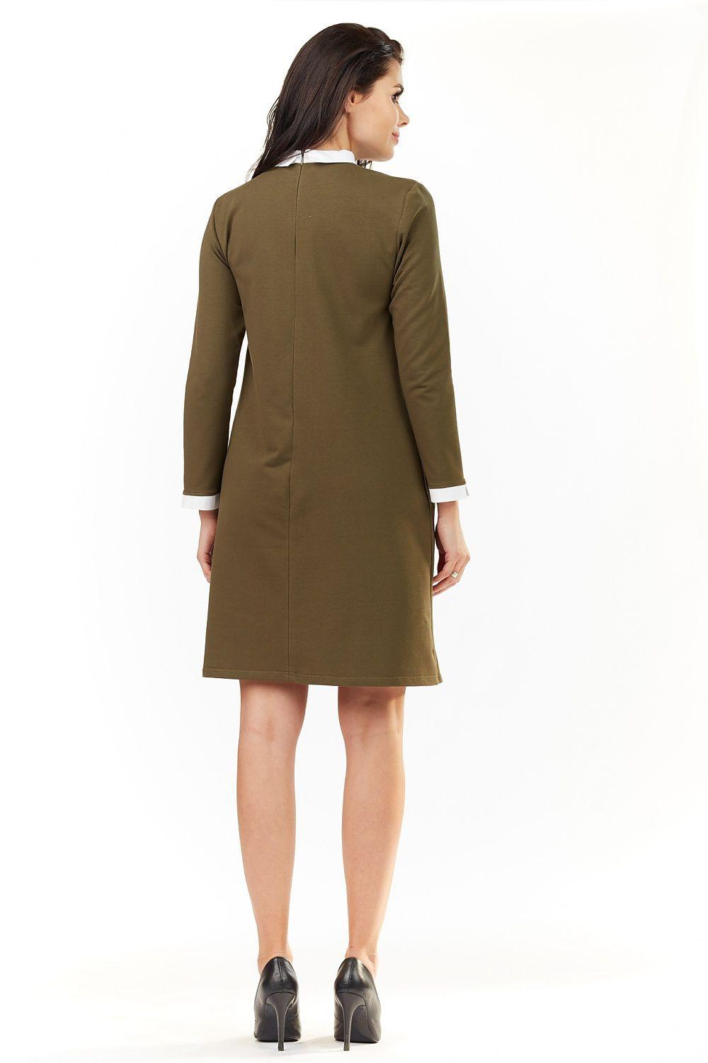 Olive green long-sleeve daydress, back view, with white cuffs