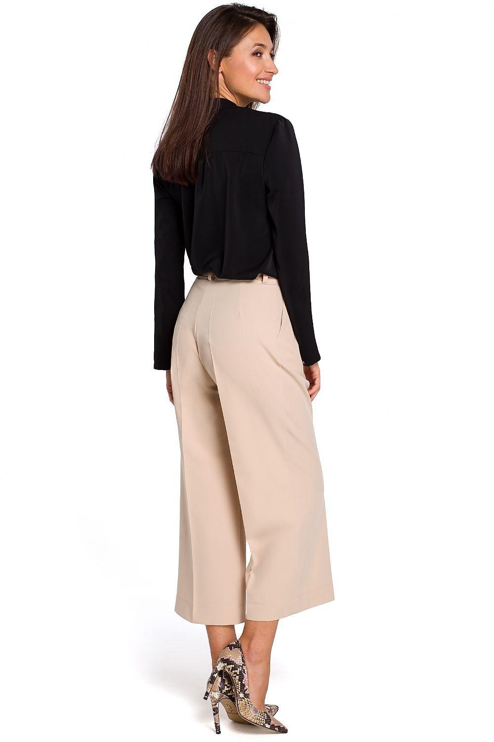 Beige wide-leg culottes trousers with button front and belt loops, side view