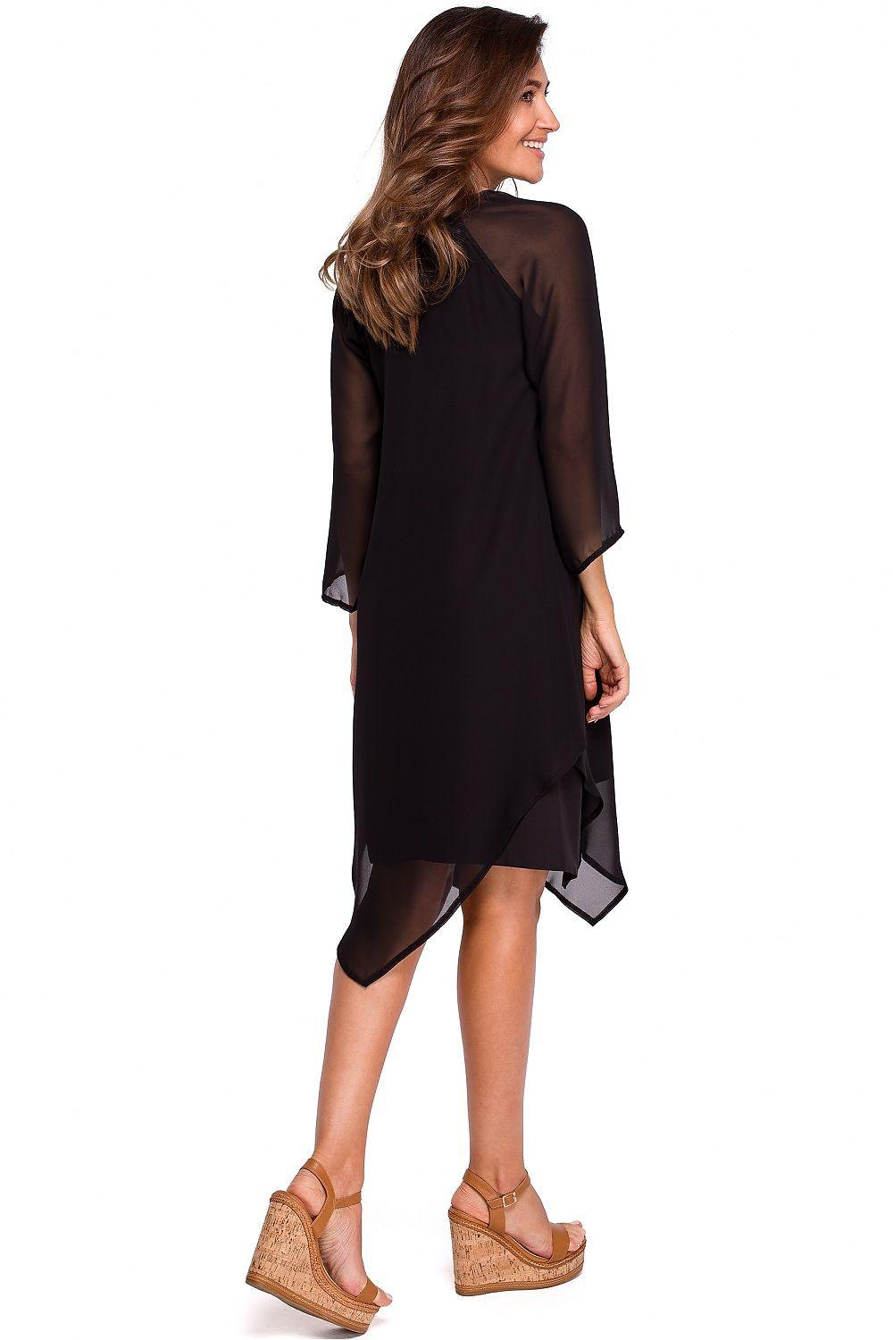 Black cocktail dress with sheer 3/4 sleeves and side-swoop asymmetric hem