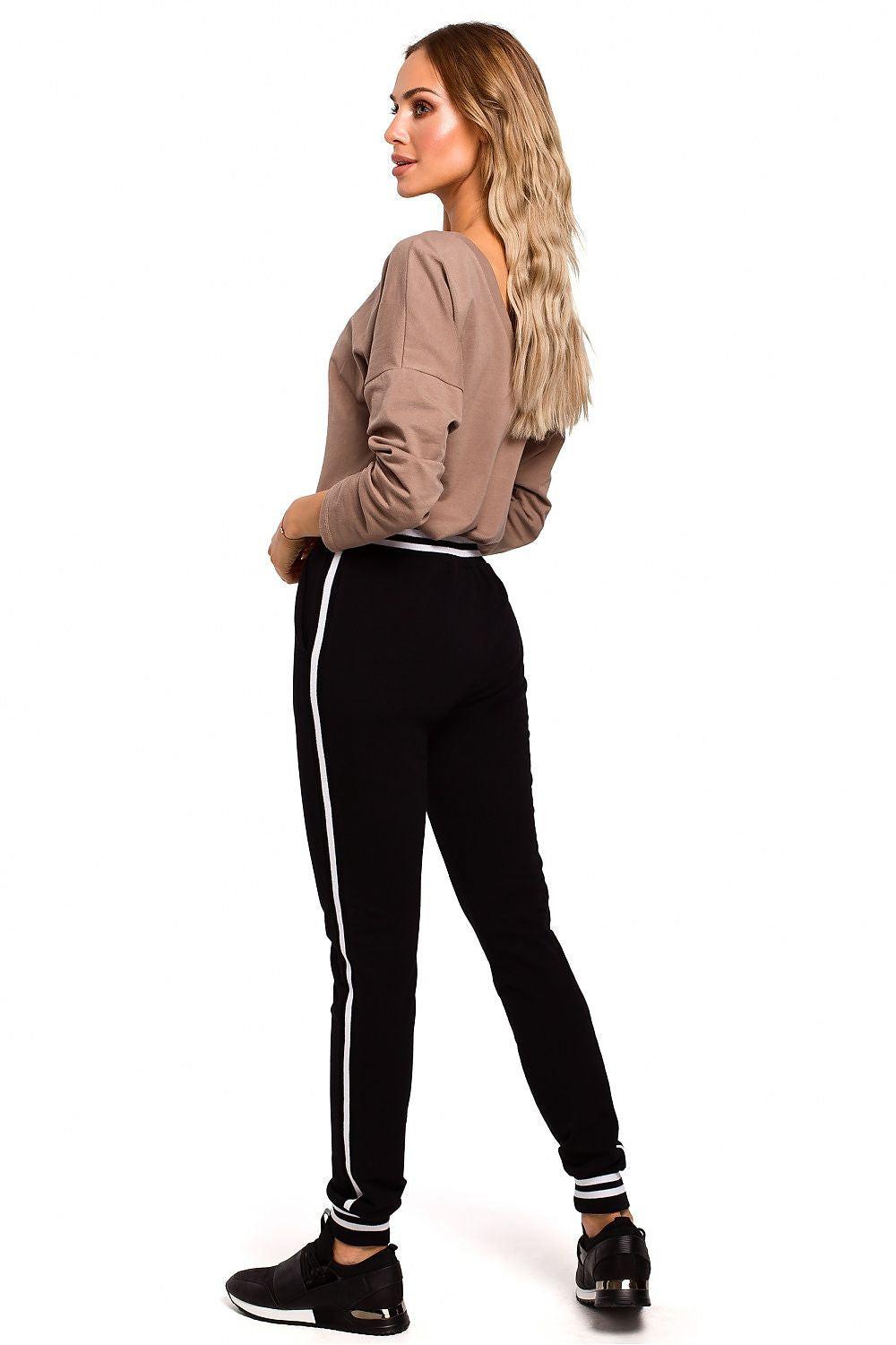 Women’s trousers, black with white side stripe and tapered legs