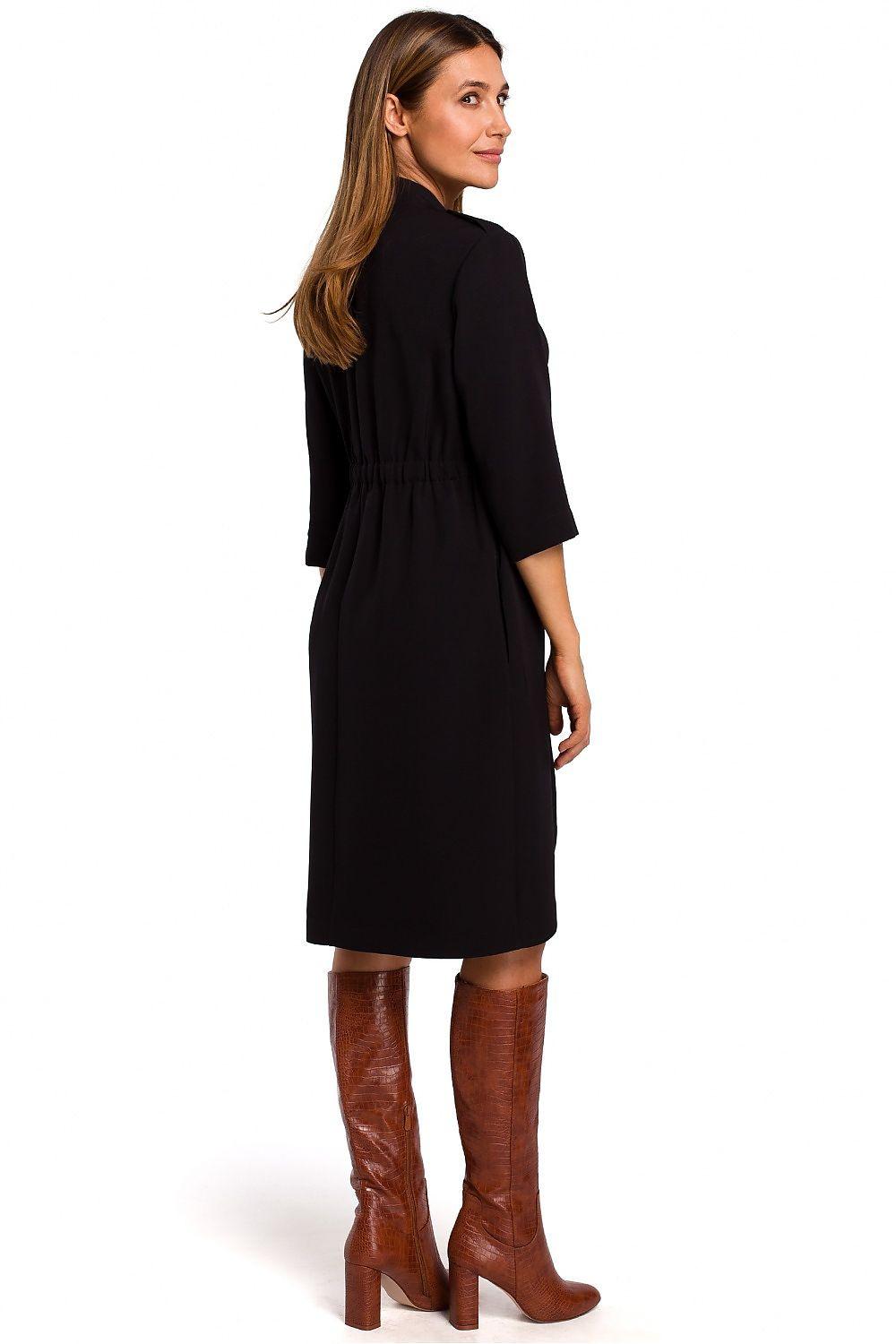 Black daydress side view with button-front placket and gathered waist