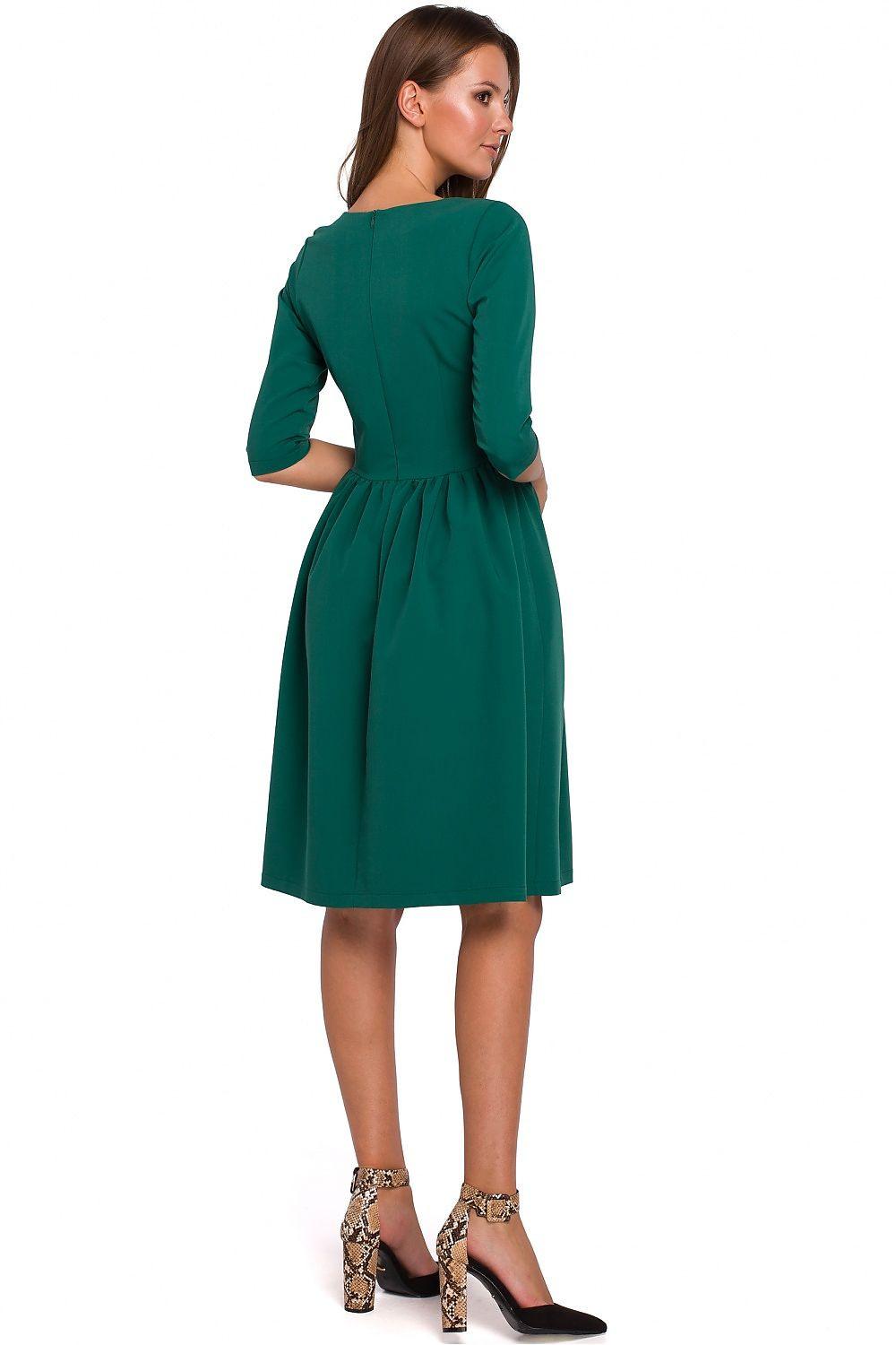 Green daydress back view with 3/4 sleeves and gathered waist, flared skirt