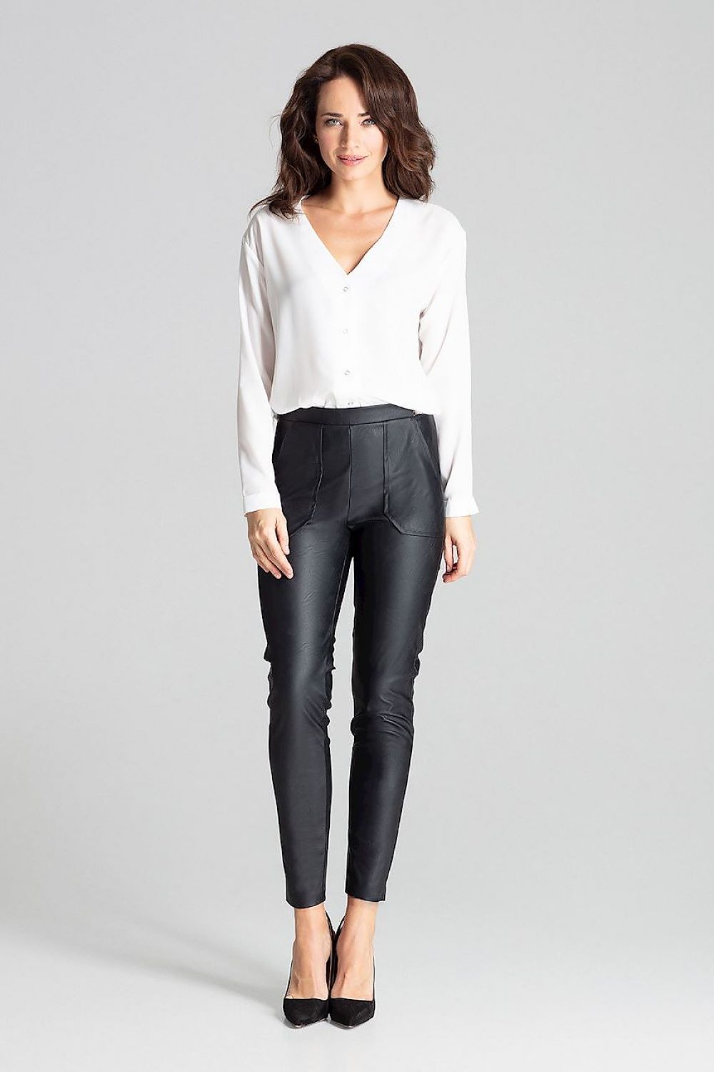 Black slim-fit eco-leather trousers with tapered legs and ankle length